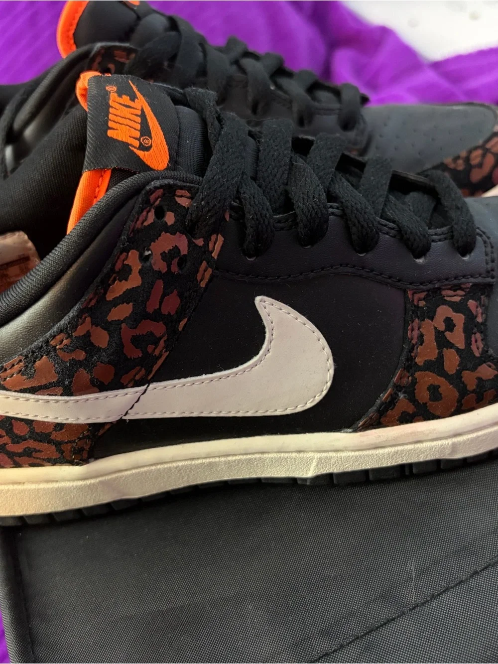 Nike Women’s Low-Top Sneakers in Black with Brown Leopard Accents